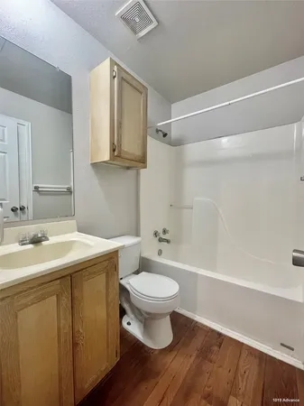 a bathroom with a sink a toilet and a bathtub
