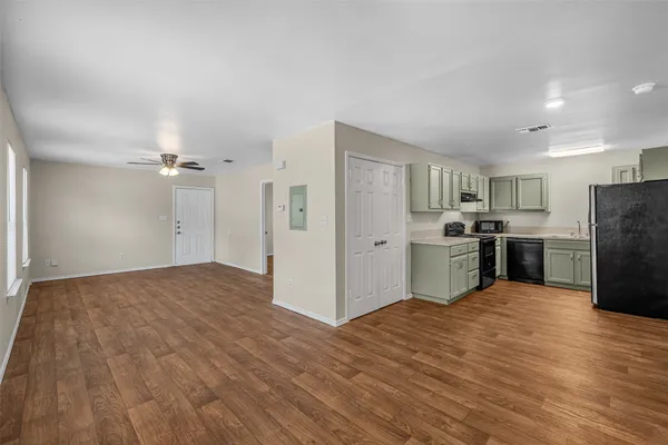 a view of kitchen with wooden floor