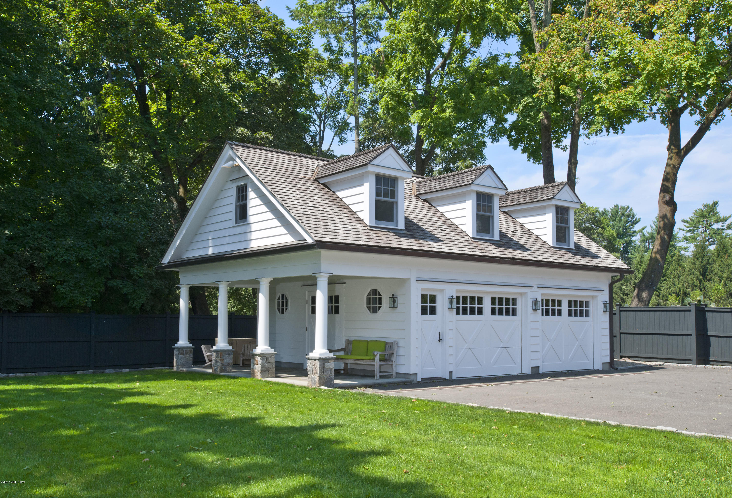 176 Stanwich Road Greenwich, CT 06830 - Photo 11 of 29 front view of a house with a yard