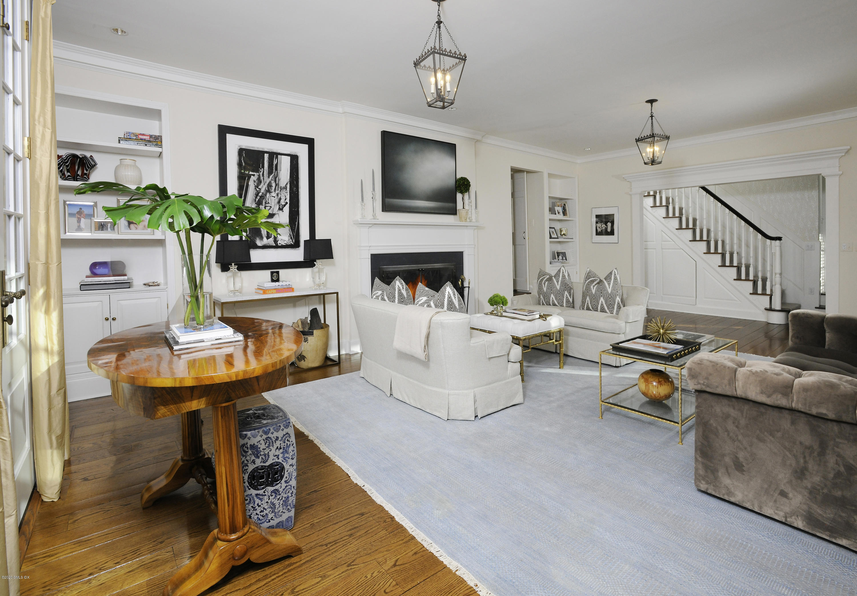 176 Stanwich Road Greenwich, CT 06830 - Photo 13 of 29 a living room with furniture a fireplace and a flat screen tv