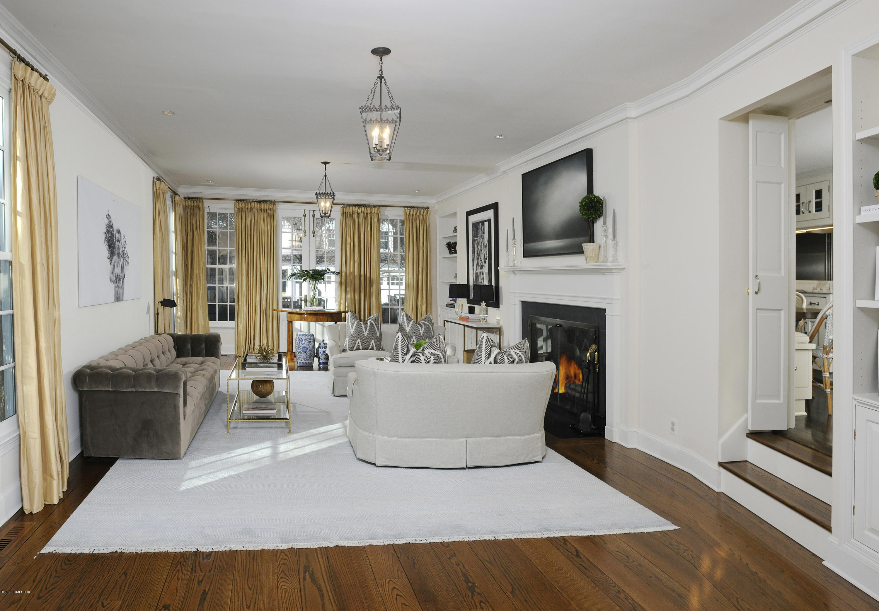 176 Stanwich Road Greenwich, CT 06830 - Photo 14 of 29 a living room with furniture a flat screen tv and a fireplace