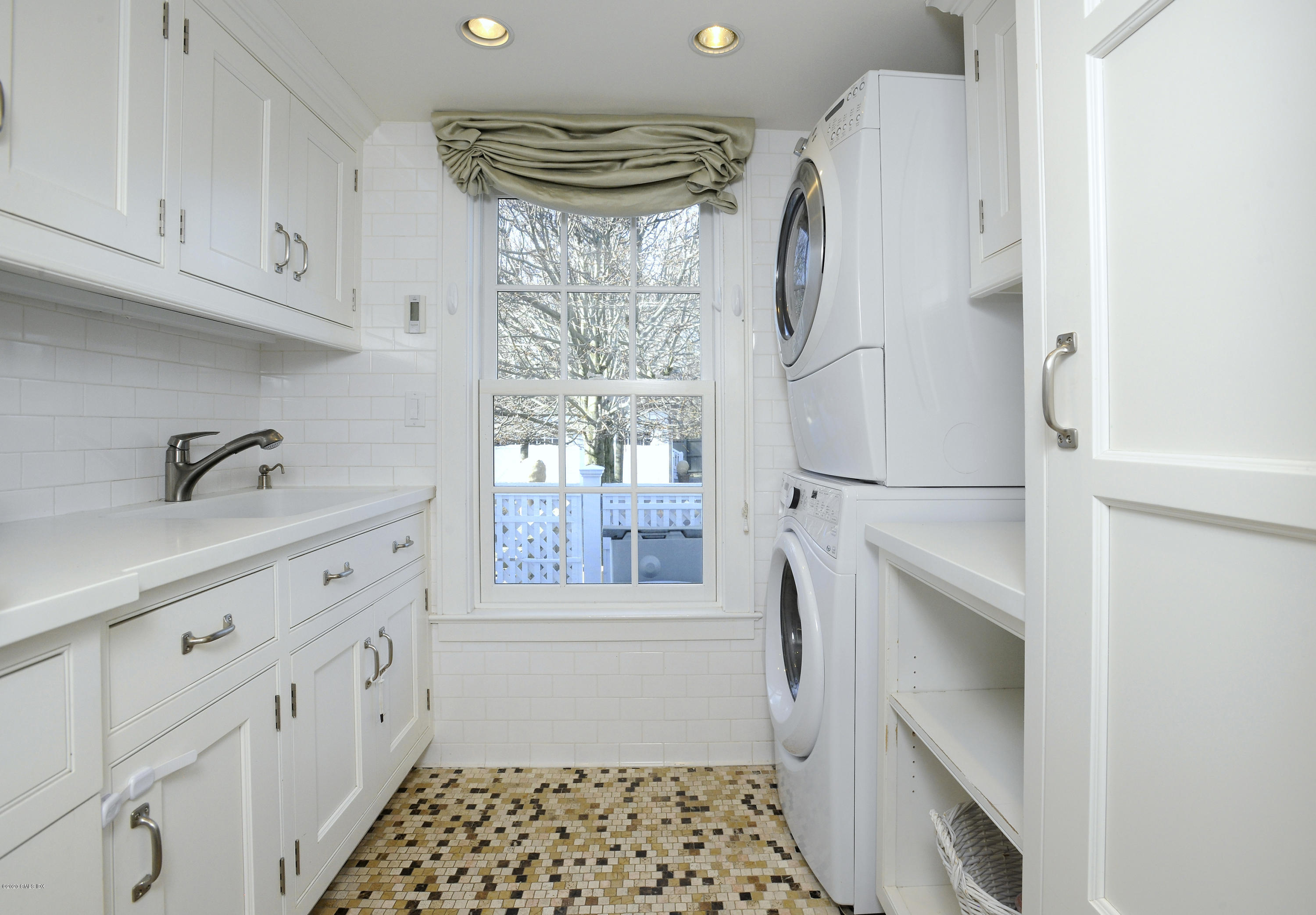 176 Stanwich Road Greenwich, CT 06830 - Photo 18 of 29 a kitchen with stainless steel appliances granite countertop a refrigerator and a sink