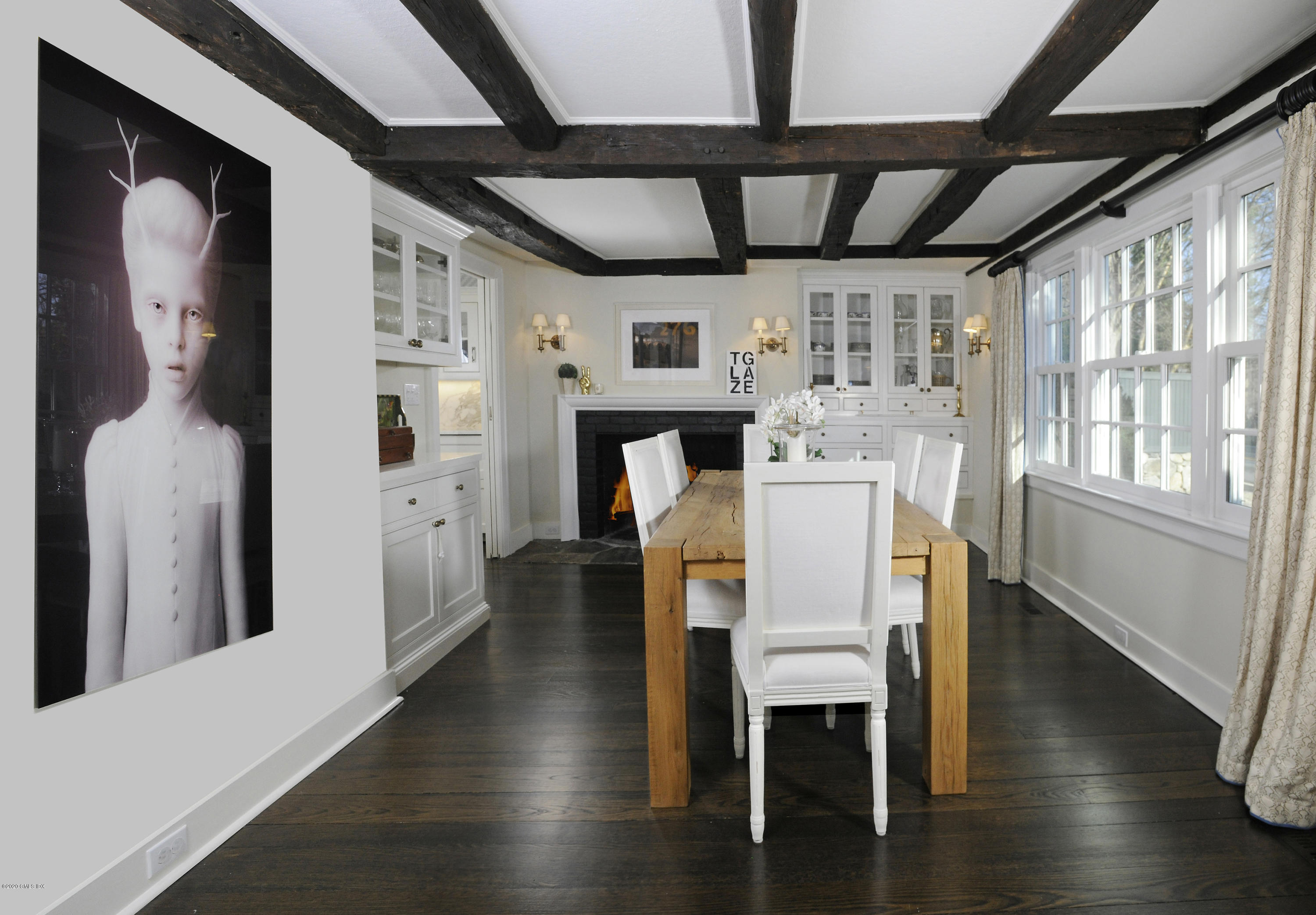 176 Stanwich Road Greenwich, CT 06830 - Photo 19 of 29 a dining room with furniture and wooden floor