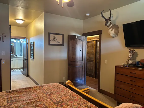 a bedroom with bed and a window