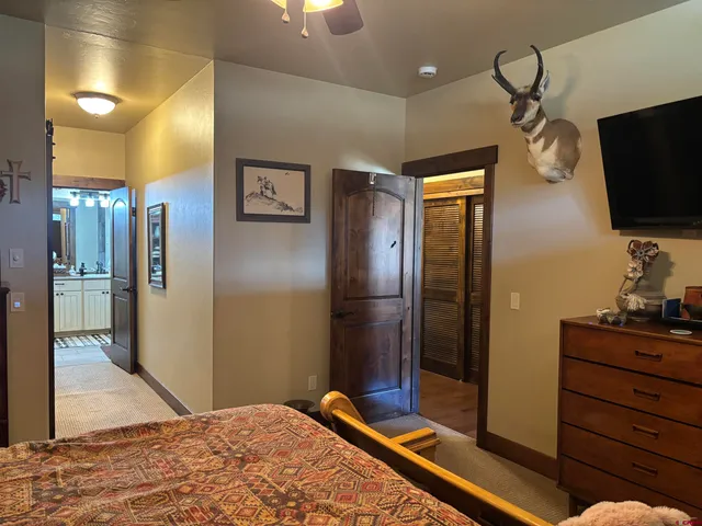 a bedroom with bed and a window