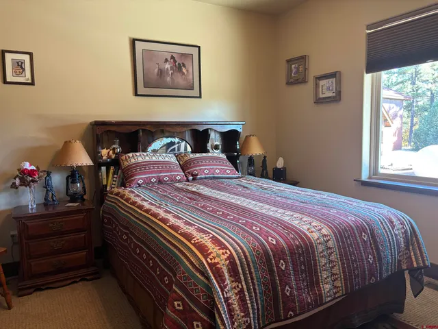 a bathroom with a sink toilet and mirror