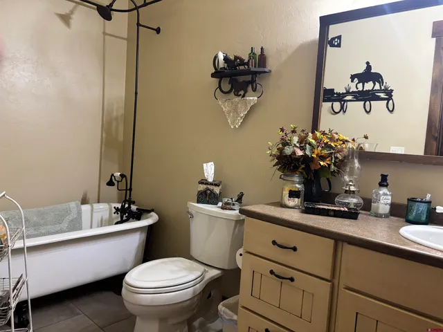 a bathroom with a sink mirror and vanity
