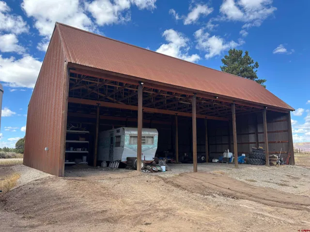 a view of a house with snow in the yard