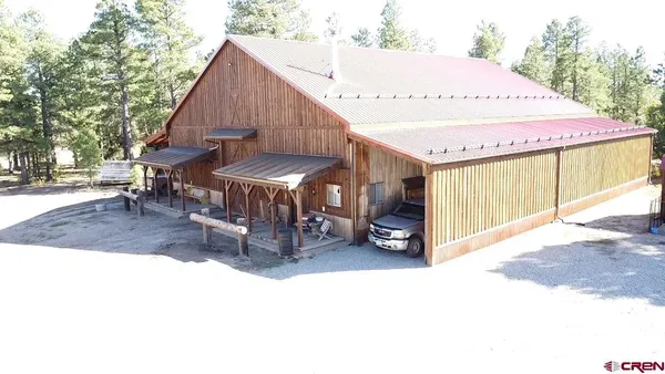 a view of a car park in front of house