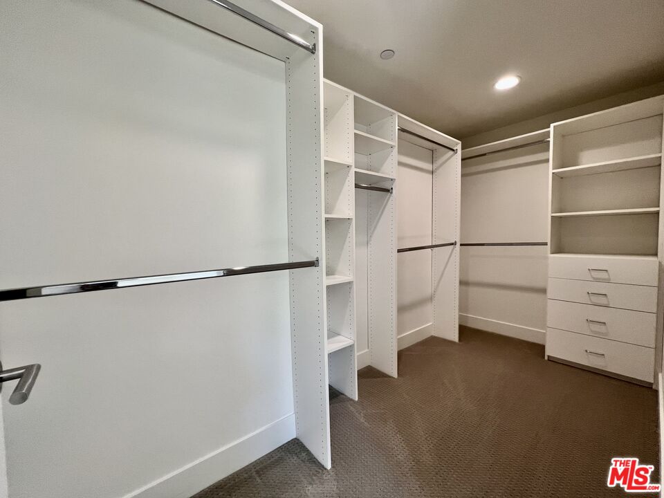 11715 Bellagio Road, Unit 104 Los Angeles, CA 90049 - Photo 11 of 25 a view of an empty walk in closet