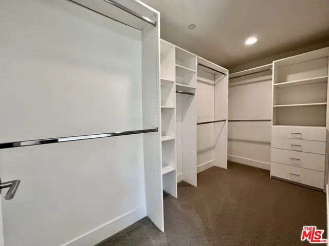 a view of an empty walk in closet