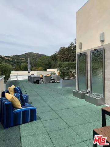 a view of a terrace with seating area