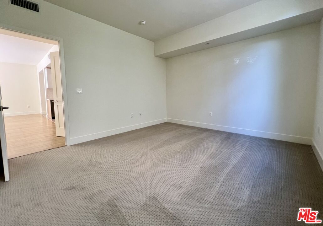 11715 Bellagio Road, Unit 104 Los Angeles, CA 90049 - Photo 9 of 26 a view of empty room