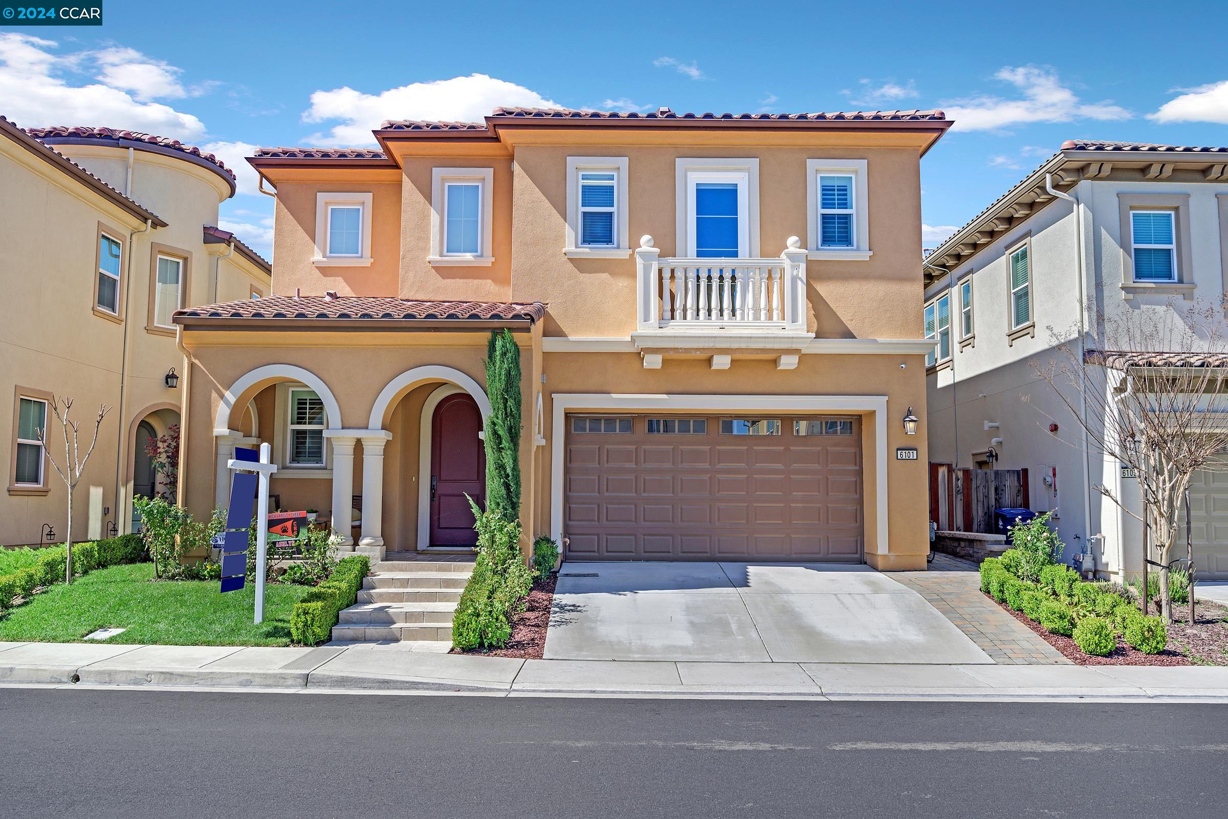 a front view of a house with small garden