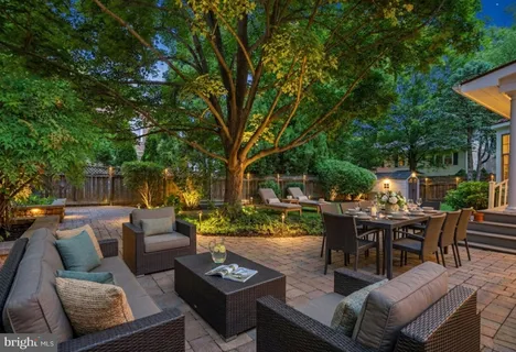 a patio with patio a couch and chairs