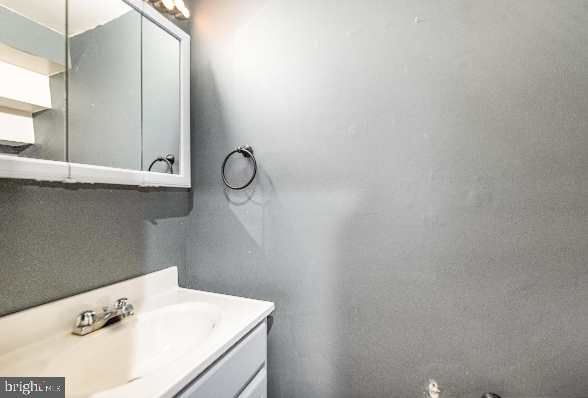 664 Washington Boulevard Baltimore, MD 21230 - Photo 10 of 30 a bathroom with a sink and cabinets