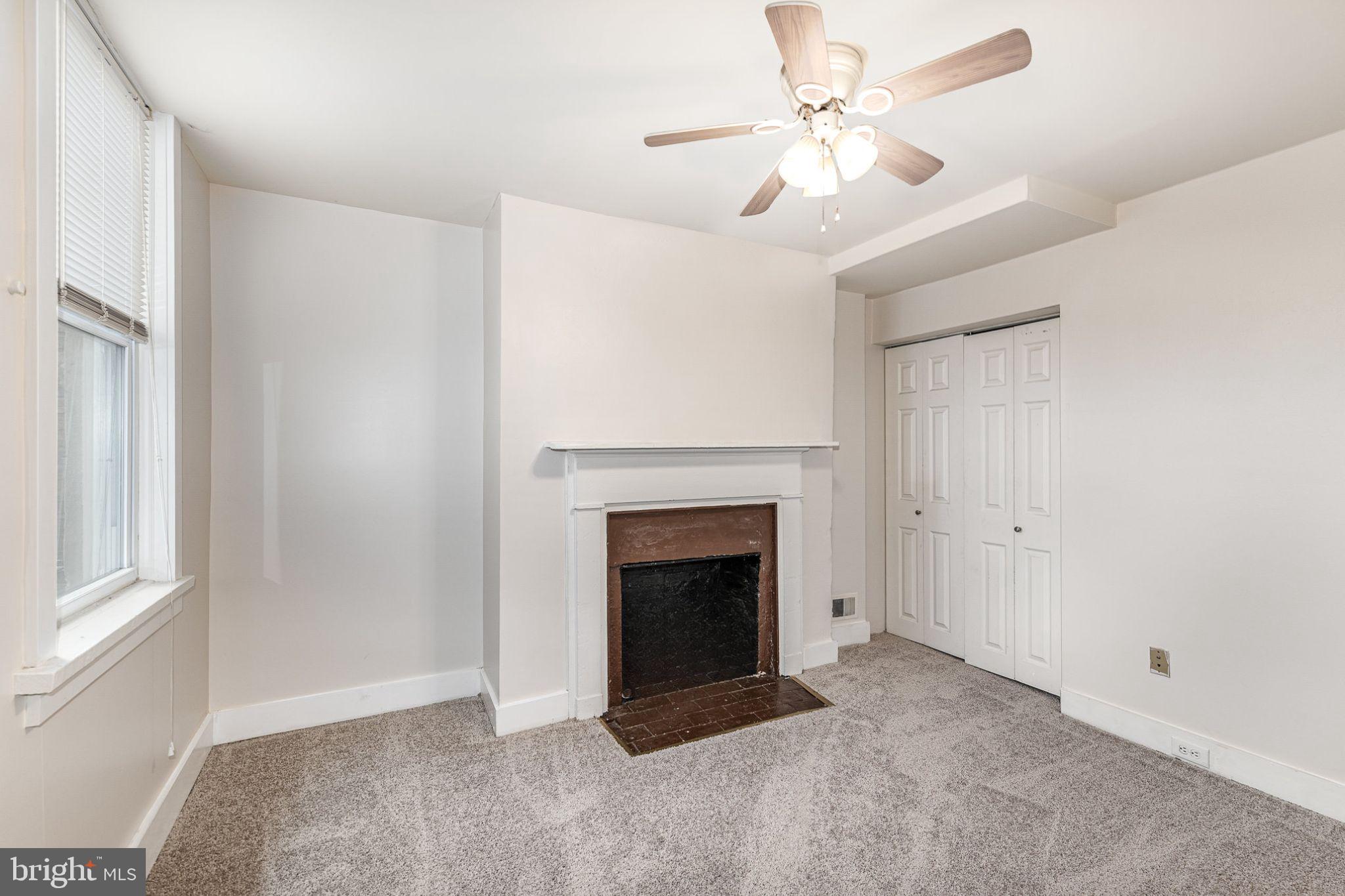 664 Washington Boulevard Baltimore, MD 21230 - Photo 11 of 30 a living room with furniture and a fireplace