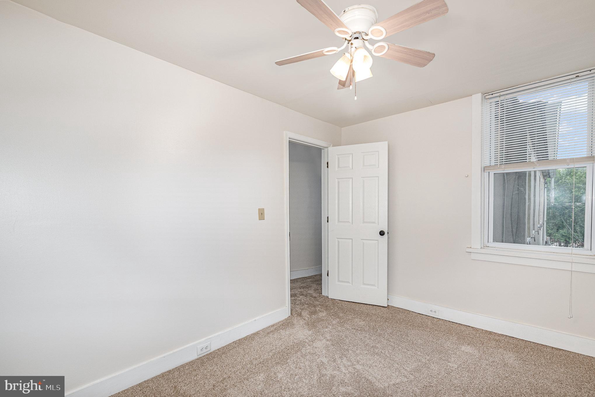 664 Washington Boulevard Baltimore, MD 21230 - Photo 12 of 30 an empty room with windows and fan