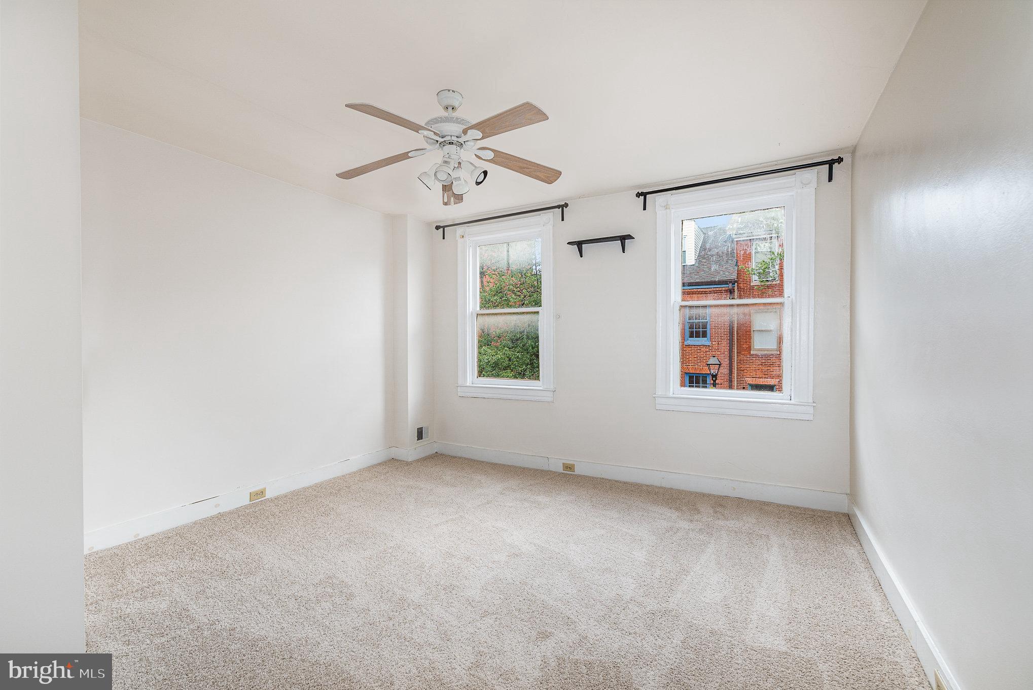 664 Washington Boulevard Baltimore, MD 21230 - Photo 13 of 30 an empty room with windows and fan