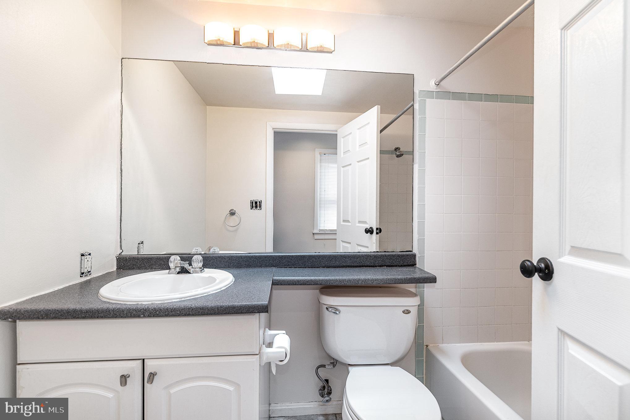 664 Washington Boulevard Baltimore, MD 21230 - Photo 15 of 30 a bathroom with a sink toilet and shower