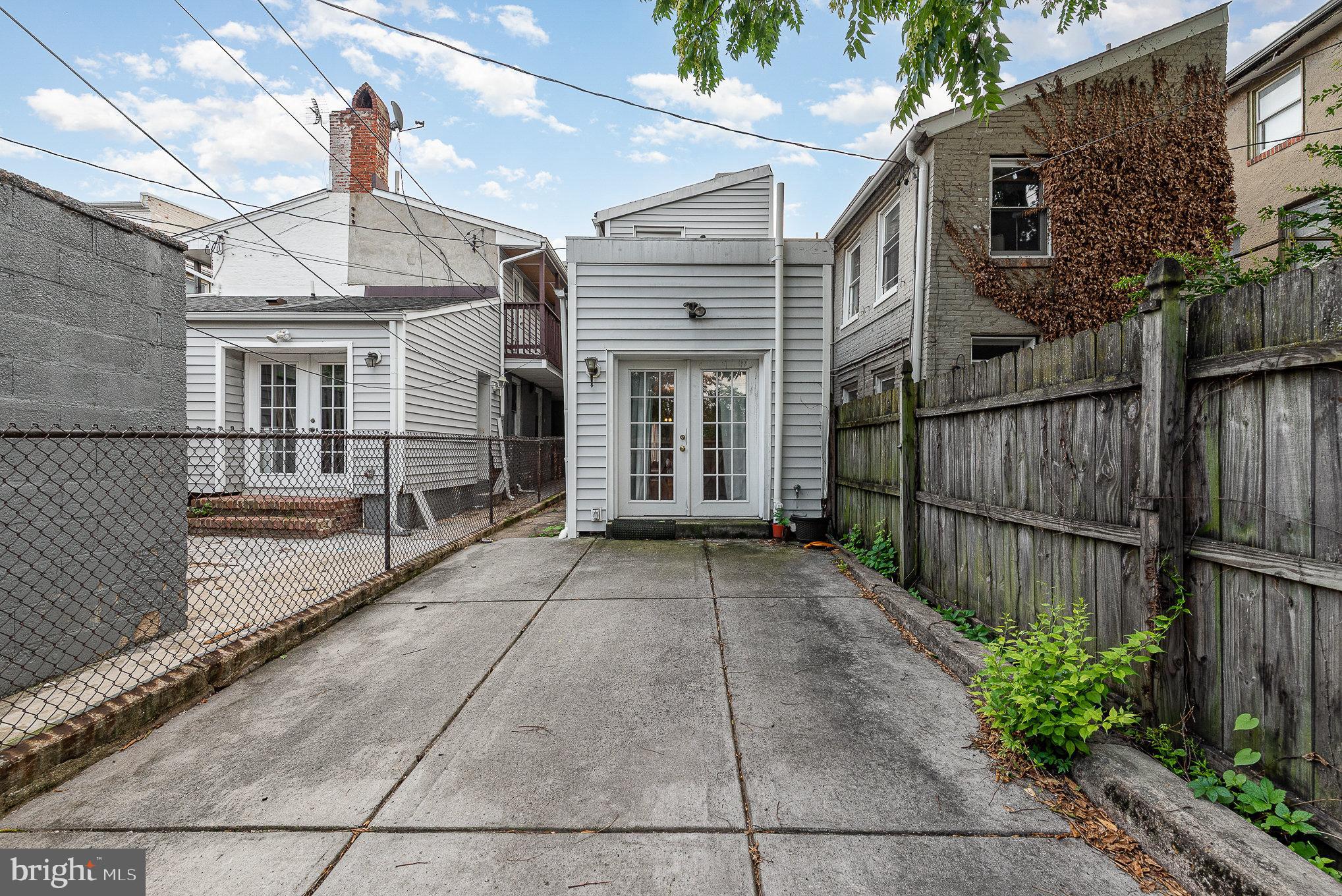 664 Washington Boulevard Baltimore, MD 21230 - Photo 22 of 30 a view of a house with a wooden fence