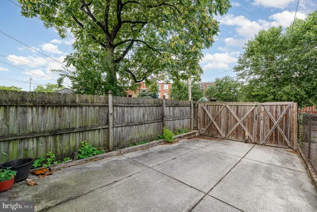 a view of a house with a black gate