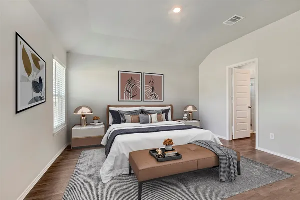 a bed room with a bed and a painting