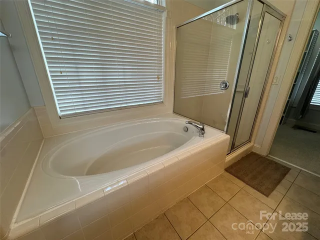 a white bath tub sitting next to a white sink