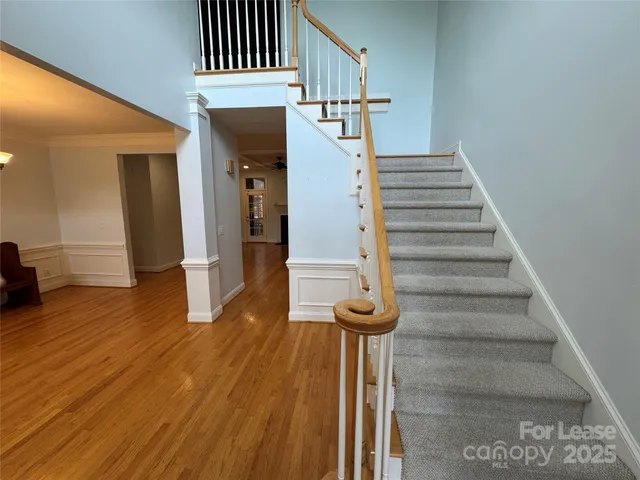 a view of entryway and hall with wooden floor