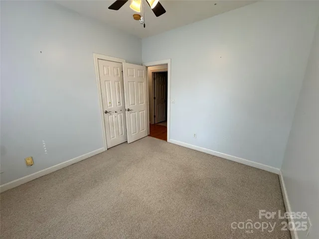 a bathroom with a double vanity sink a mirror and a shower