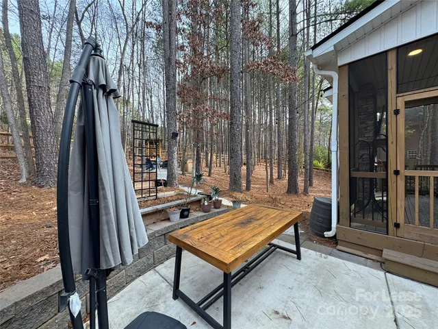 a view of a backyard with sitting area