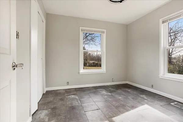 an empty room with windows