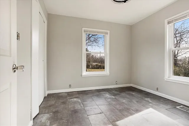 an empty room with windows