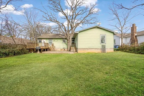 a house view with outdoor space and garden