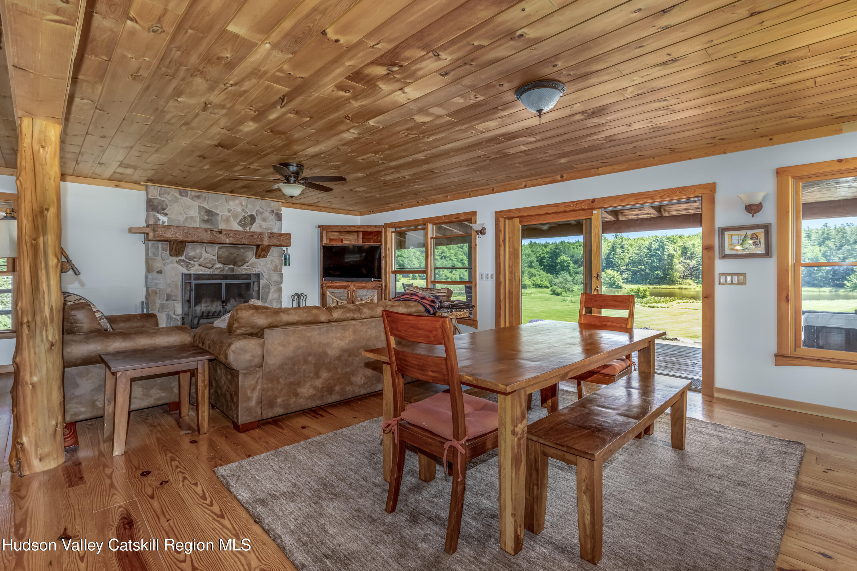 688 Bruce Porn Road Gilboa, NY 12167 - Photo 44 of 104 a dining room with furniture window and wooden floor