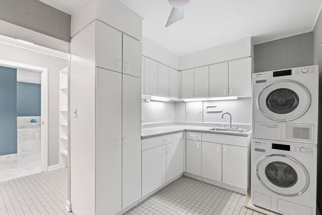 a kitchen with a sink a washer and dryer