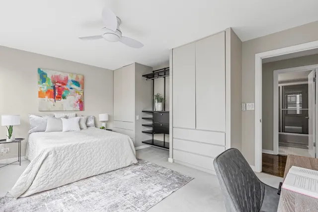 a bedroom with a bed furniture and a window