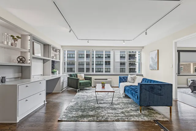 a living room with furniture and a window