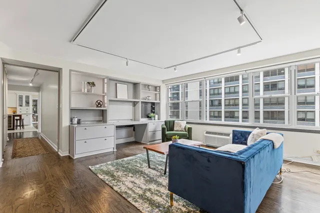 a living room with furniture and windows