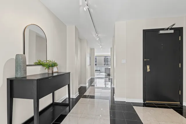 a workspace with table and entryway