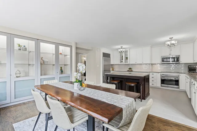 a kitchen with a table and chairs in it
