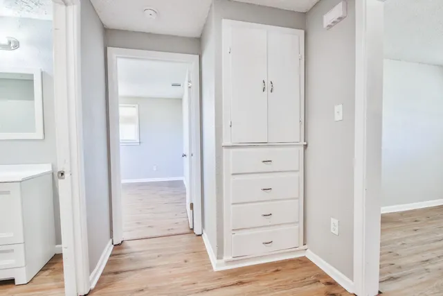 a backyard of a house with a yard and outdoor seating