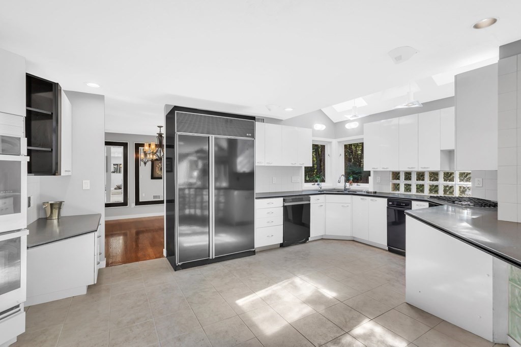 62 Chestnut Street Upton, MA 01568 - Photo 15 of 36 a large kitchen with cabinets and stainless steel appliances