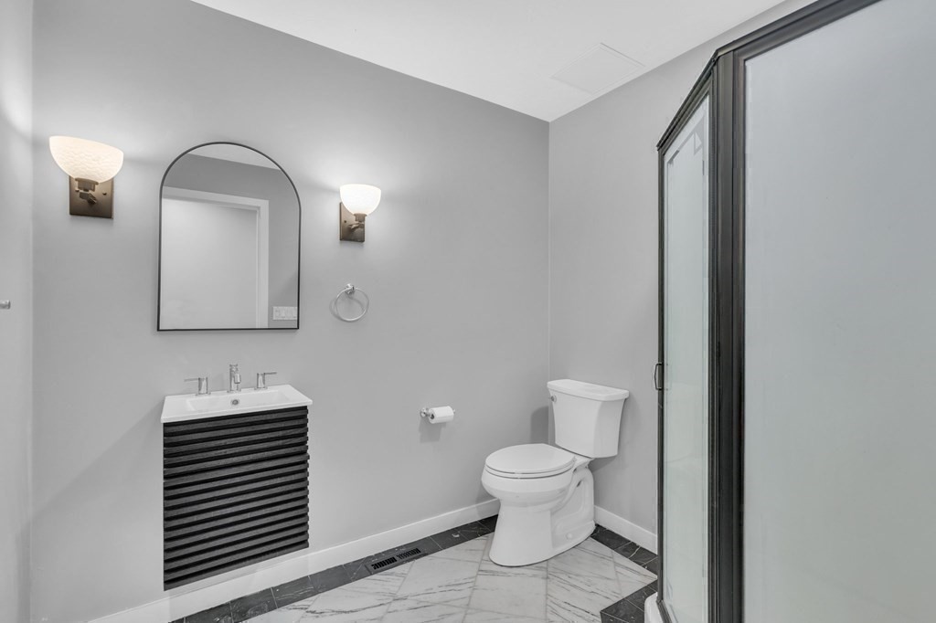 62 Chestnut Street Upton, MA 01568 - Photo 18 of 36 a bathroom with a toilet sink and mirror