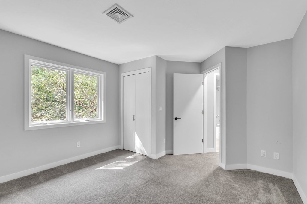 62 Chestnut Street Upton, MA 01568 - Photo 20 of 36 a view of an empty room with a window