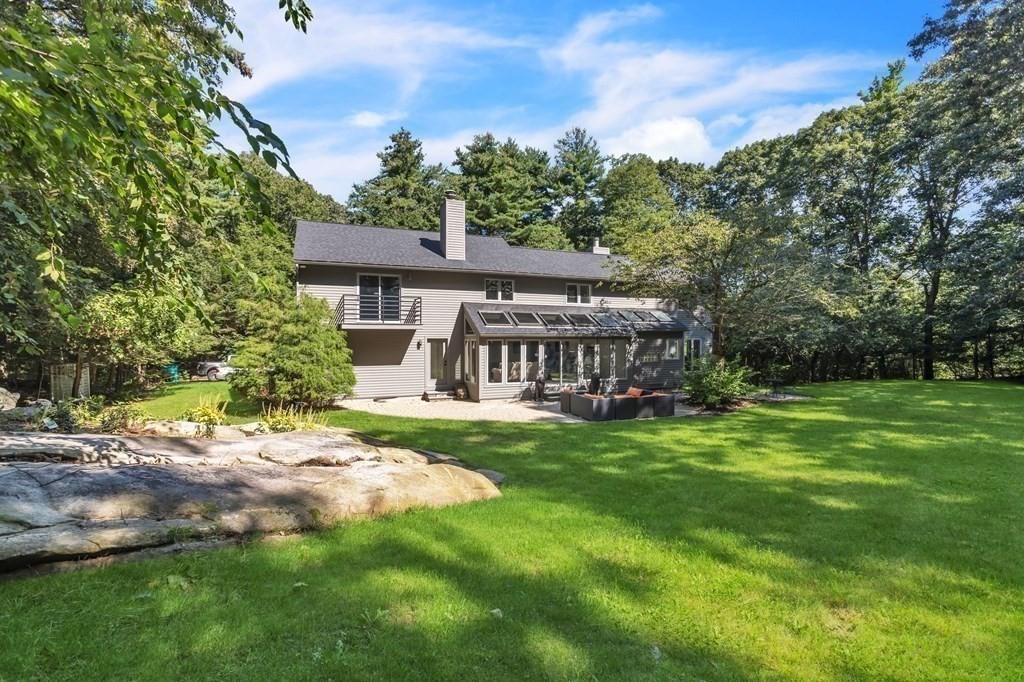 62 Chestnut Street Upton, MA 01568 - Photo 6 of 36 a view of a house with a big yard plants and large trees