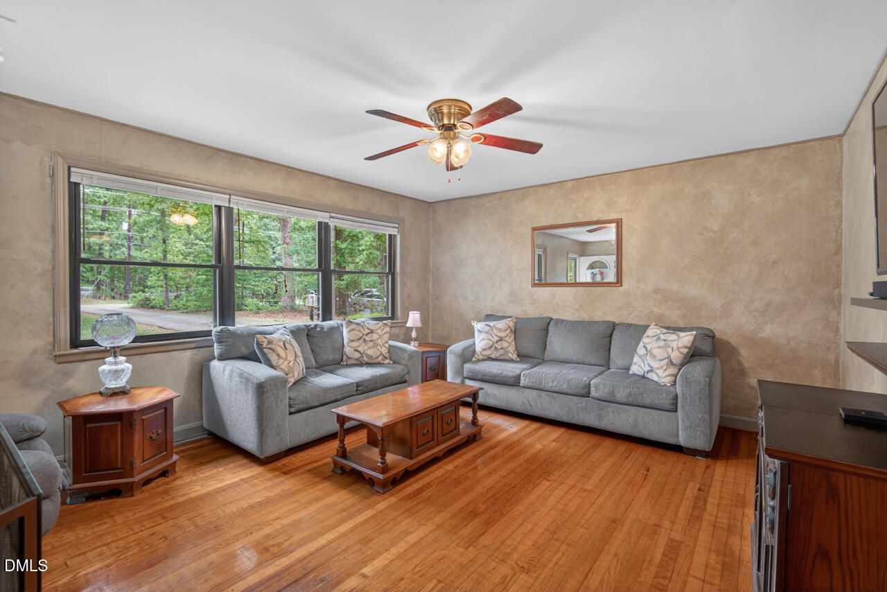 1420 Goodwin Road Durham, NC 27712 - Photo 7 of 54 a living room with furniture and a large window