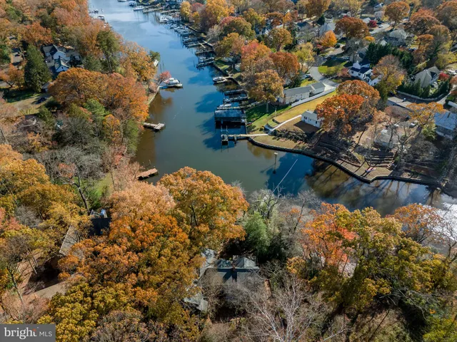 a view of a kitchen with furniture and an empty room