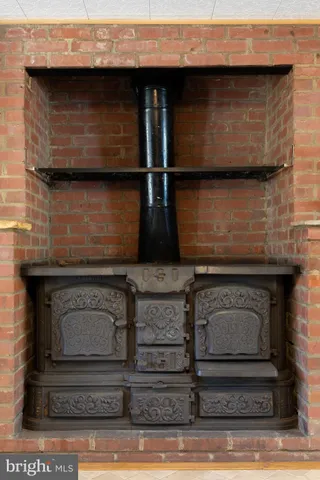 a big room with wooden floor and balcony