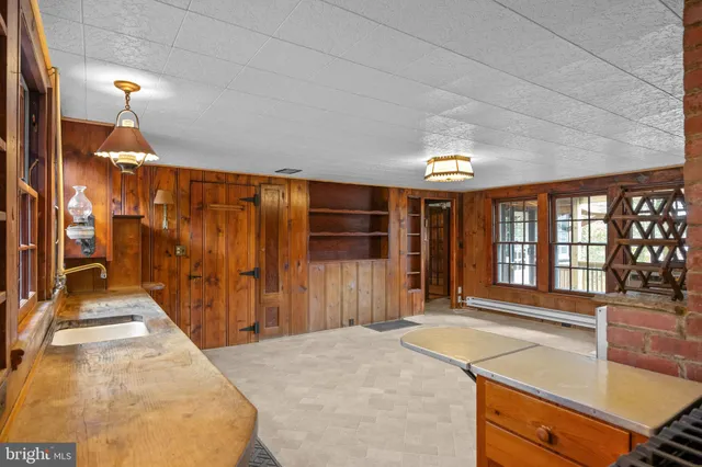 a bathroom with a toilet a sink and bathtub